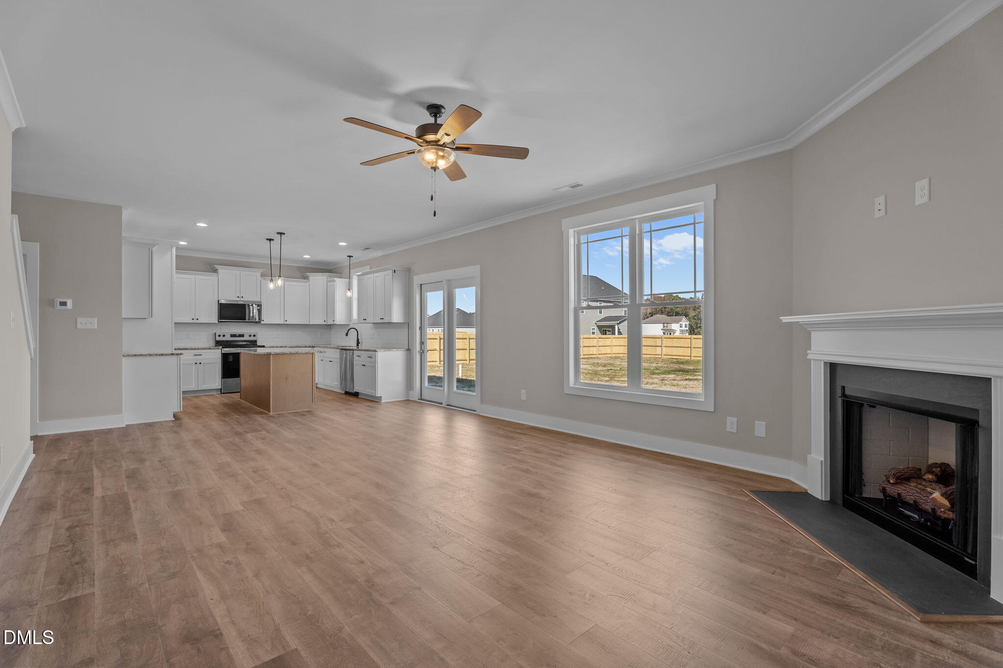 262 Fields Road Pikeville, NC 27863 - Photo 19 of 43 a view of an empty room with window and fire place