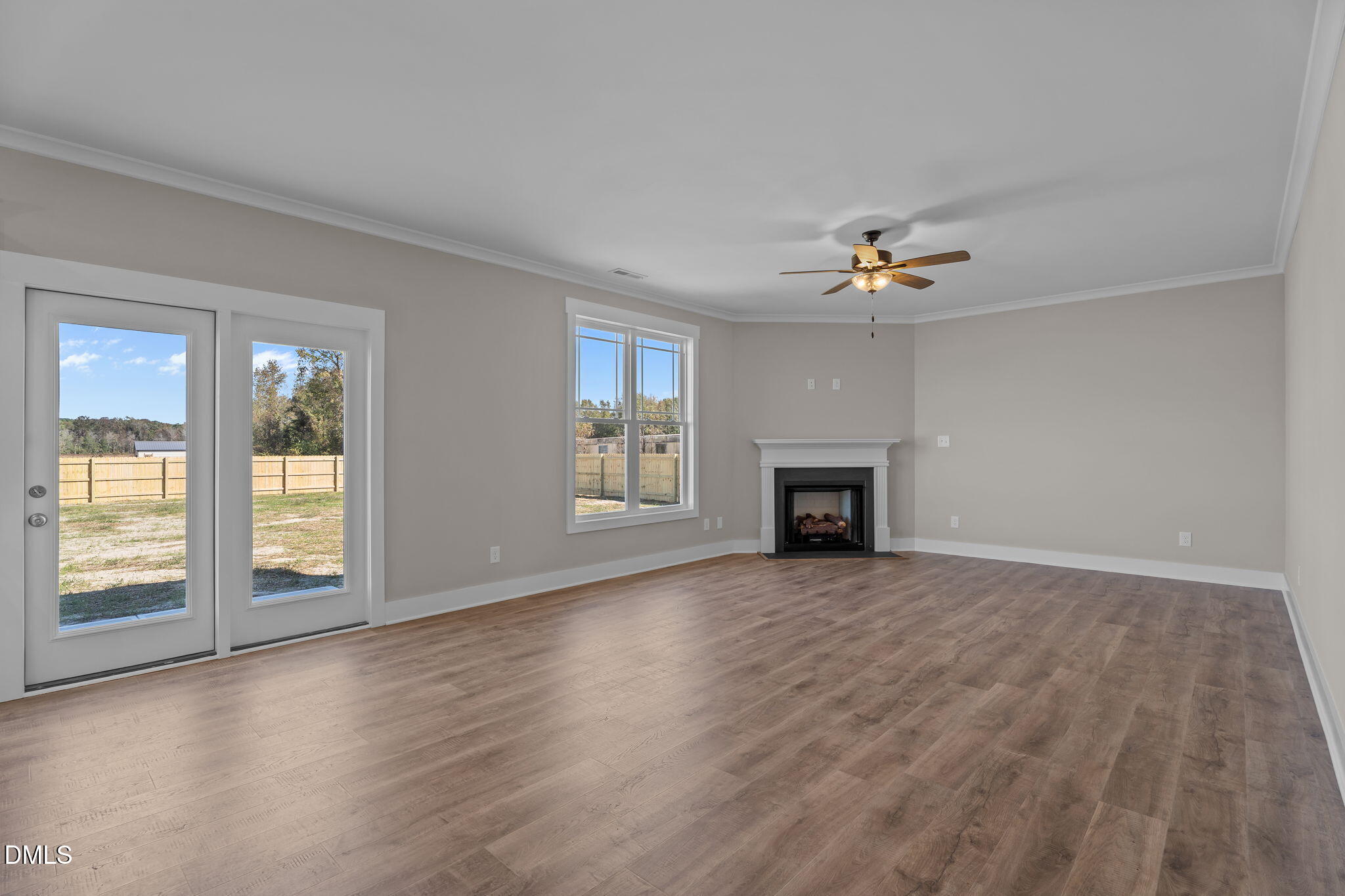 262 Fields Road Pikeville, NC 27863 - Photo 20 of 43 an empty room with windows and fireplace