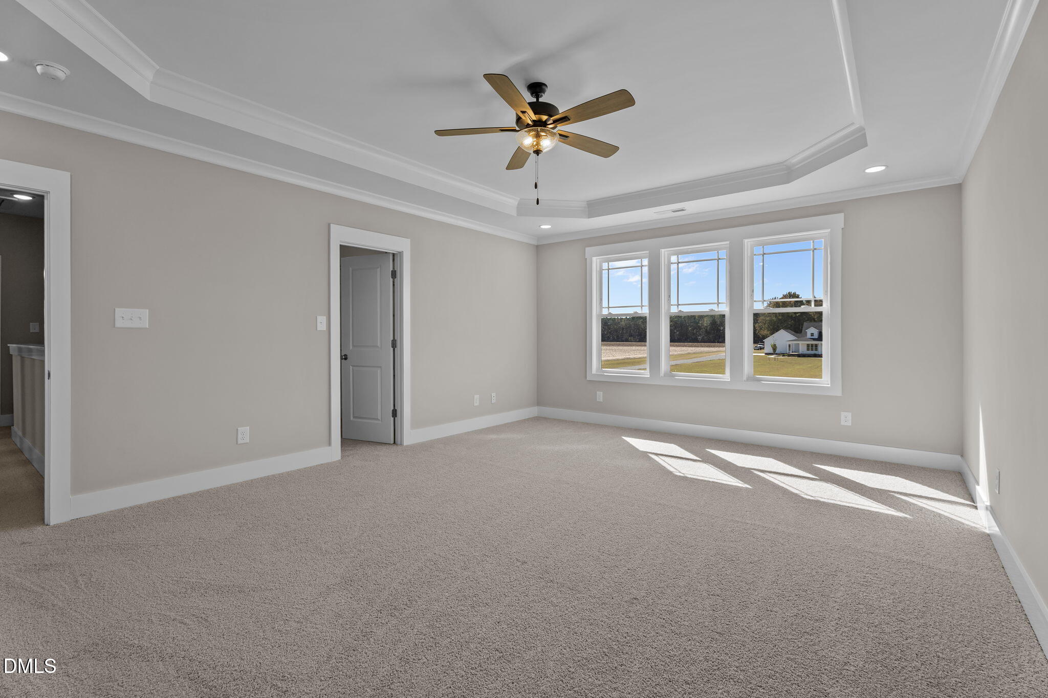 262 Fields Road Pikeville, NC 27863 - Photo 26 of 43 a view of an empty room with a ceiling fan and window