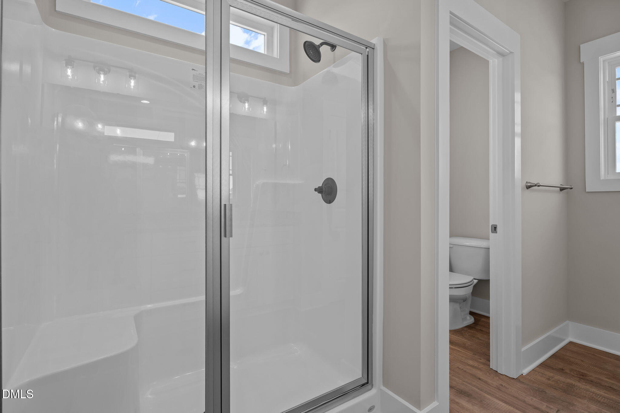 262 Fields Road Pikeville, NC 27863 - Photo 28 of 43 a bathroom with a glass shower door