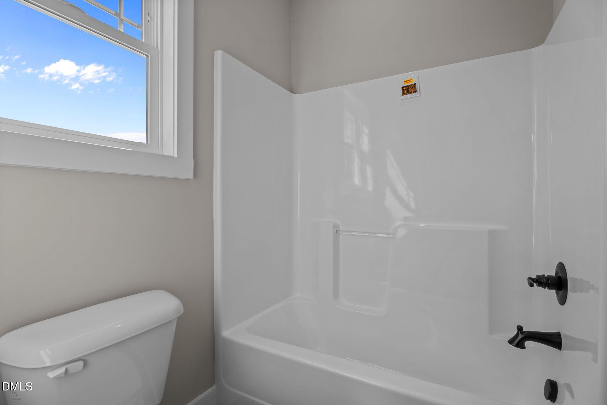 262 Fields Road Pikeville, NC 27863 - Photo 36 of 43 a bathroom with a toilet and a bathtub