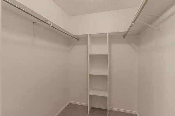 a view of an empty walk in closet