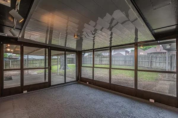 a view of an empty room with a balcony