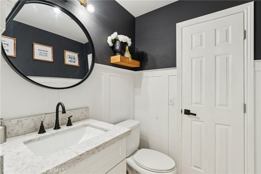 4155 Windspring Street Corona, CA 92883 - Photo 14 of 38 a bathroom with a sink and a mirror