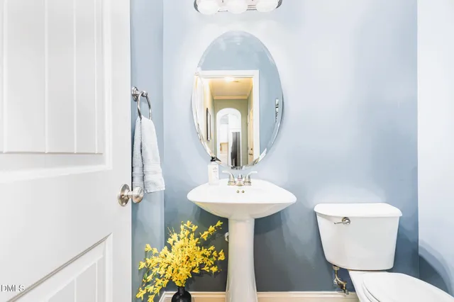 a view of a house with backyard sitting area and garden