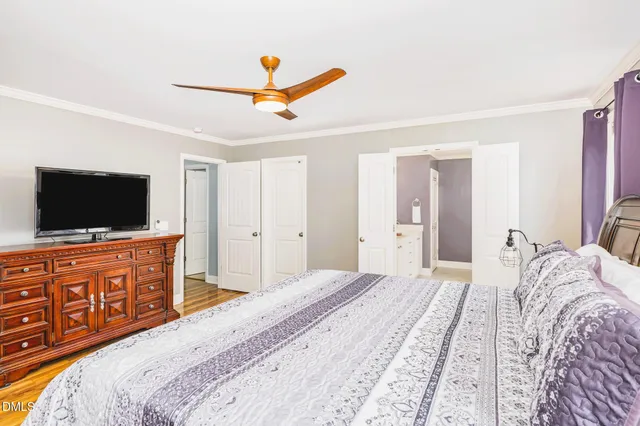 an aerial view of a house with a garden and yard