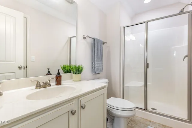 a view of house with yard and green space