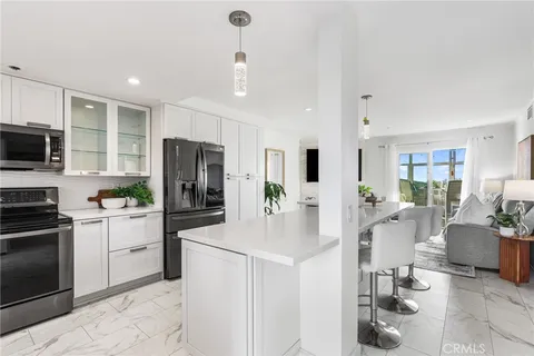 a kitchen with a sink stove and microwave