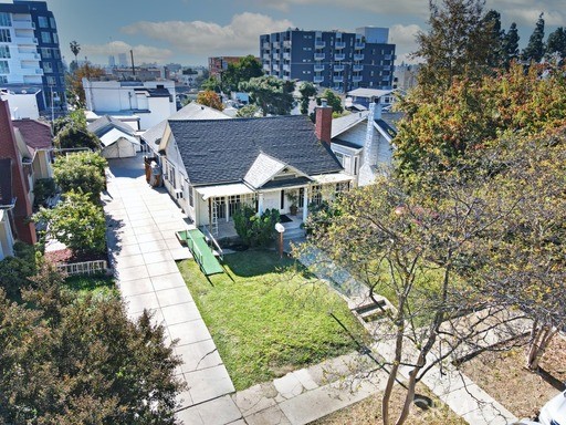 an aerial view of residential houses and outdoor space