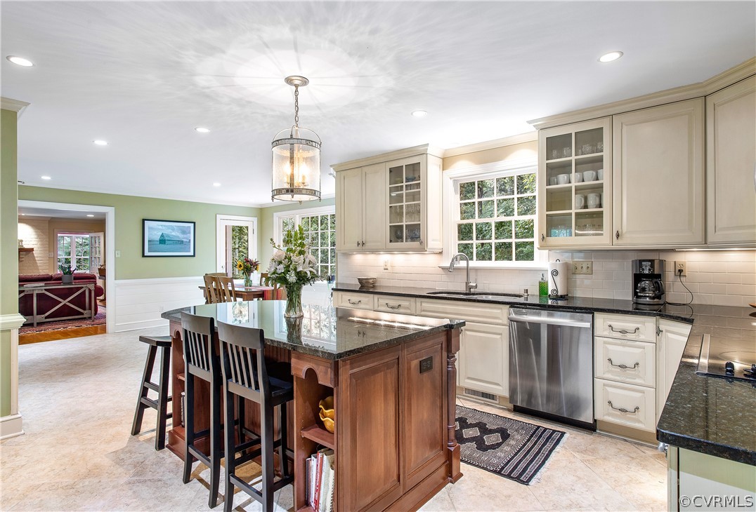 14140 Netherfield Drive Midlothian, VA 23113 - Photo 12 of 48 a open kitchen with stainless steel appliances granite countertop a stove top oven a sink dishwasher a dining table and chairs with wooden floor