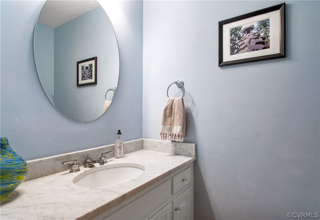14140 Netherfield Drive Midlothian, VA 23113 - Photo 16 of 48 a bathroom with a granite countertop sink and a mirror