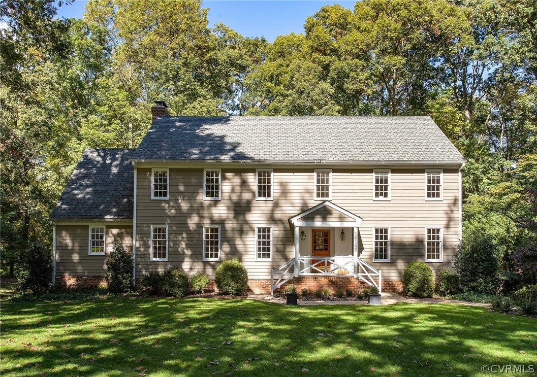 14140 Netherfield Drive Midlothian, VA 23113 - Photo 2 of 48 a front view of a house with a garden and trees