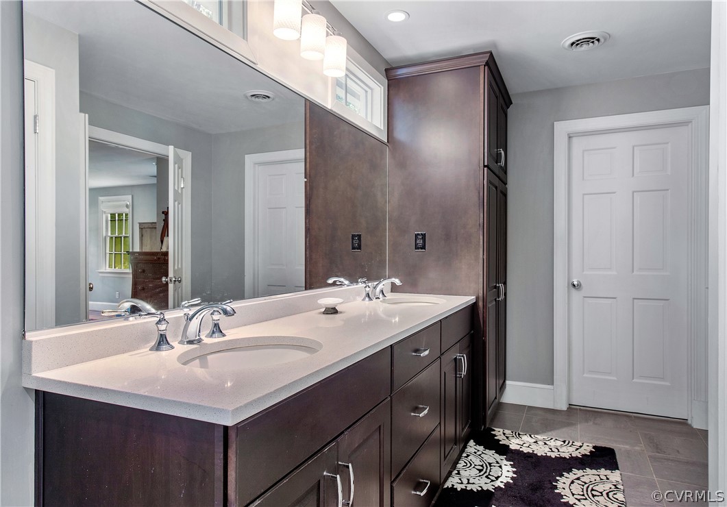 14140 Netherfield Drive Midlothian, VA 23113 - Photo 27 of 48 a bathroom with a sink and a mirror