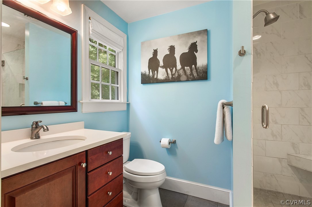 14140 Netherfield Drive Midlothian, VA 23113 - Photo 32 of 48 a bathroom with a toilet sink and mirror