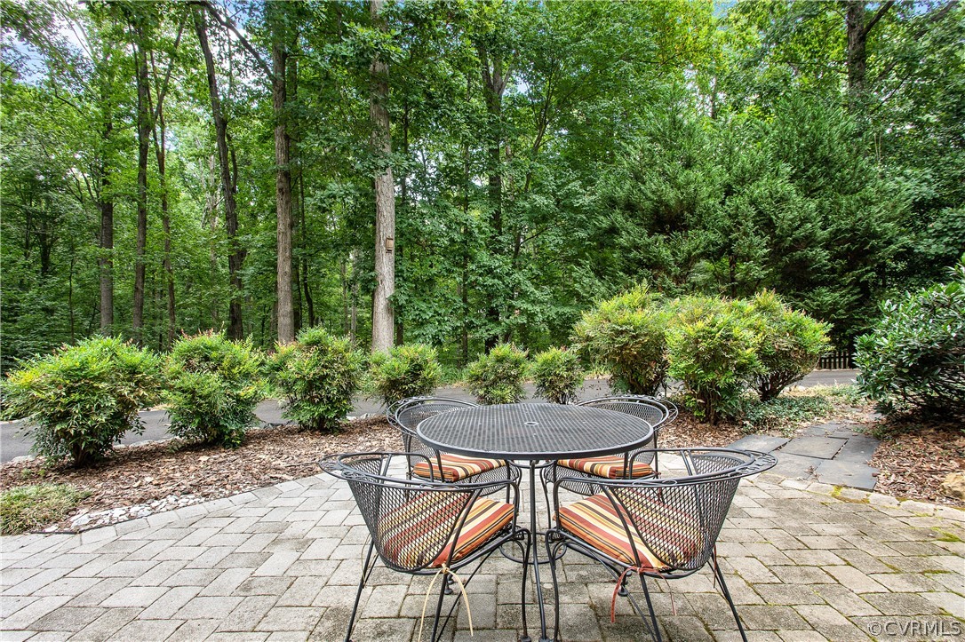 14140 Netherfield Drive Midlothian, VA 23113 - Photo 43 of 48 a backyard of a house with table and chairs