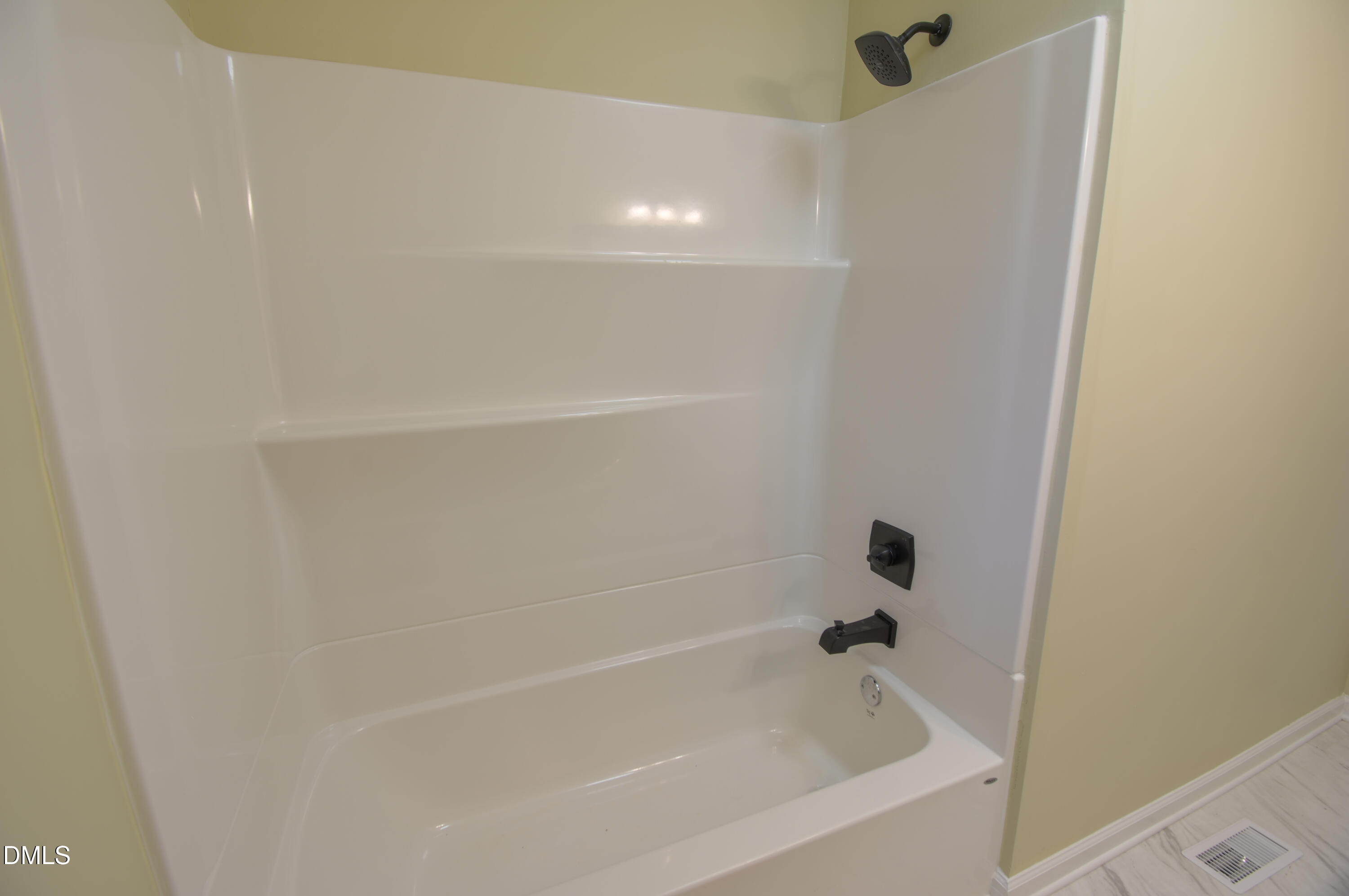1412 Chamblee Road Zebulon, NC 27597 - Photo 14 of 22 a close view of a bathtub in bathroom