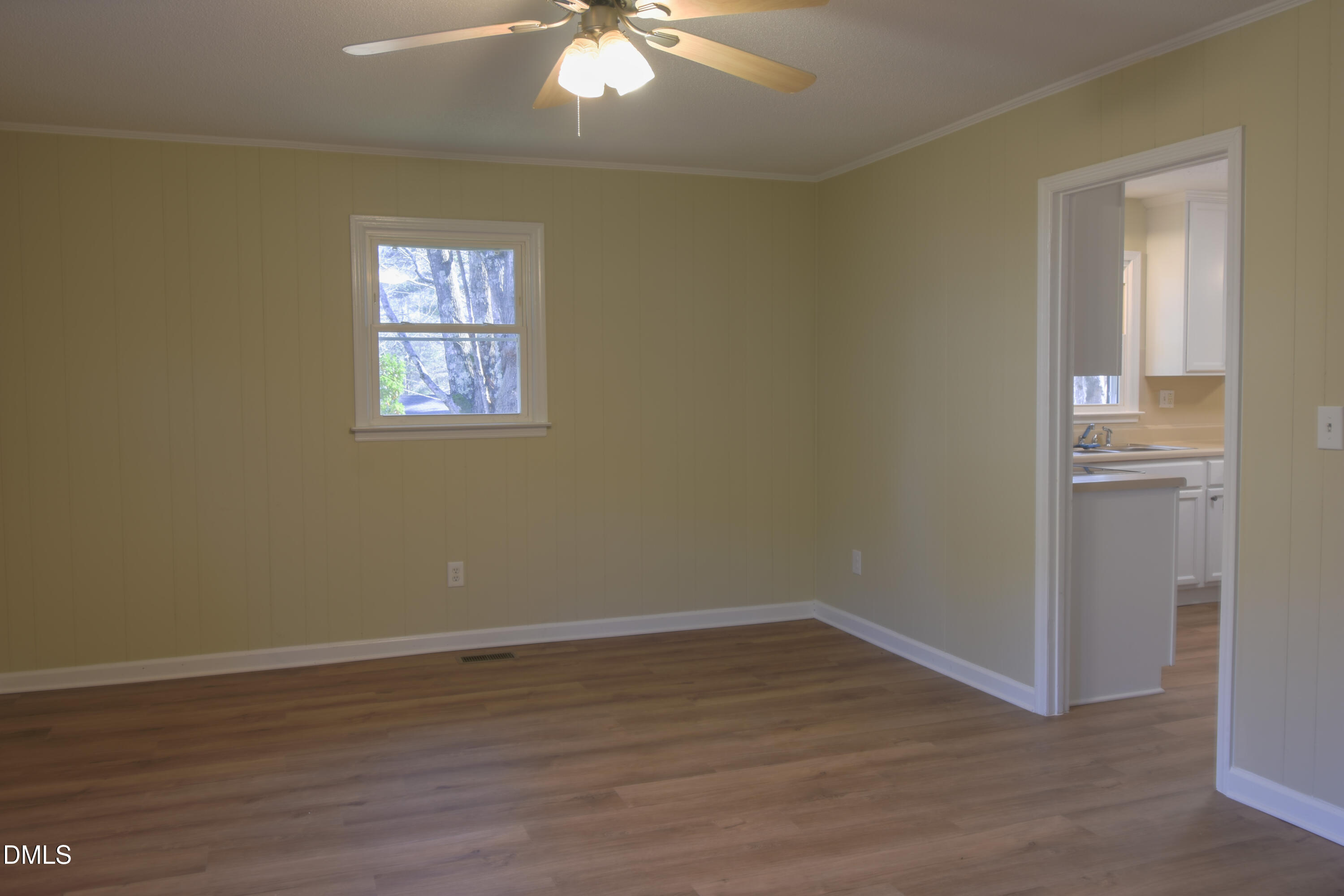 1412 Chamblee Road Zebulon, NC 27597 - Photo 15 of 22 wooden floor in an empty room with a window