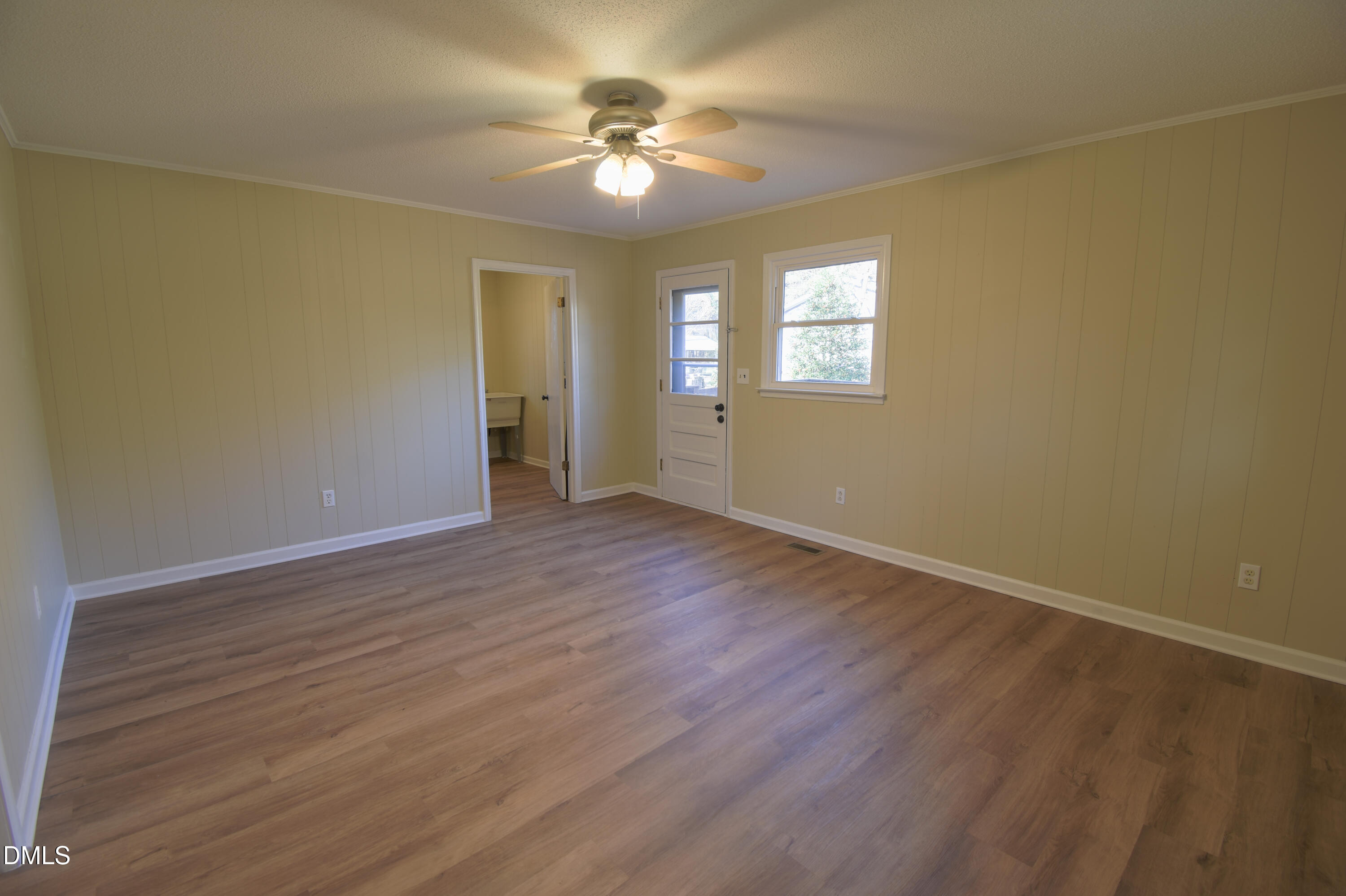 1412 Chamblee Road Zebulon, NC 27597 - Photo 16 of 22 wooden floor in an empty room with a window