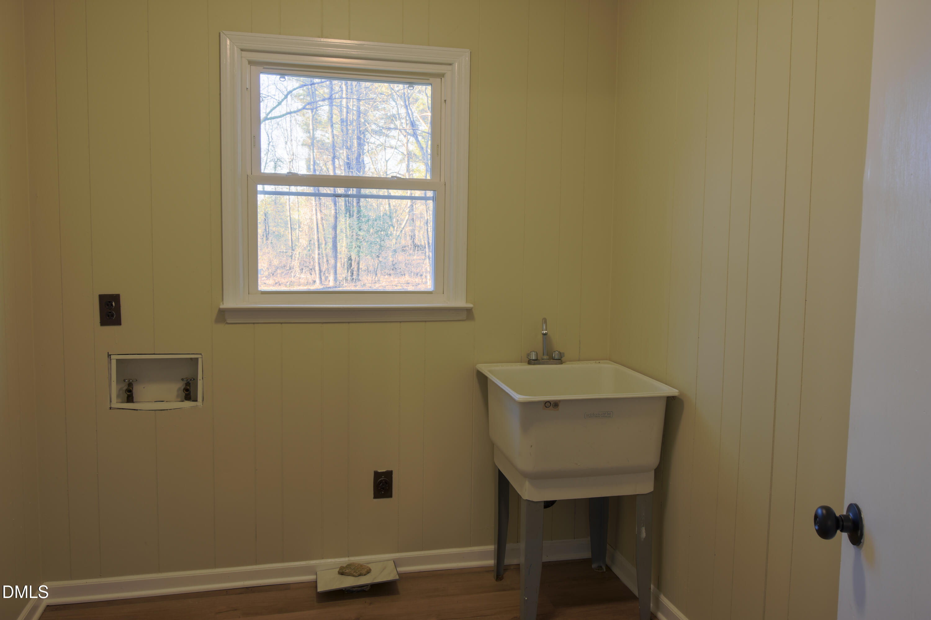 1412 Chamblee Road Zebulon, NC 27597 - Photo 17 of 22 a bathroom with a sink a toilet and a window