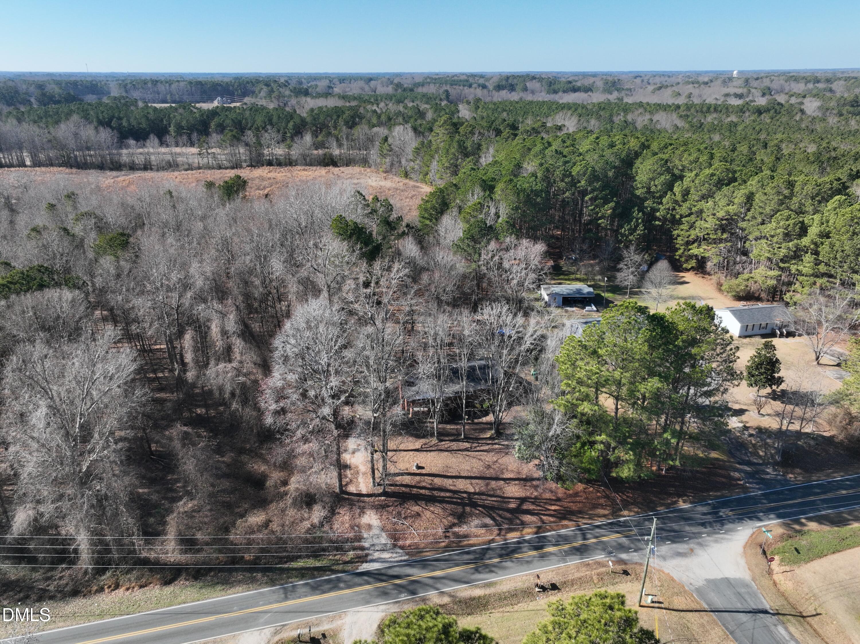 1412 Chamblee Road Zebulon, NC 27597 - Photo 18 of 22 a view of a yard with an outdoor space