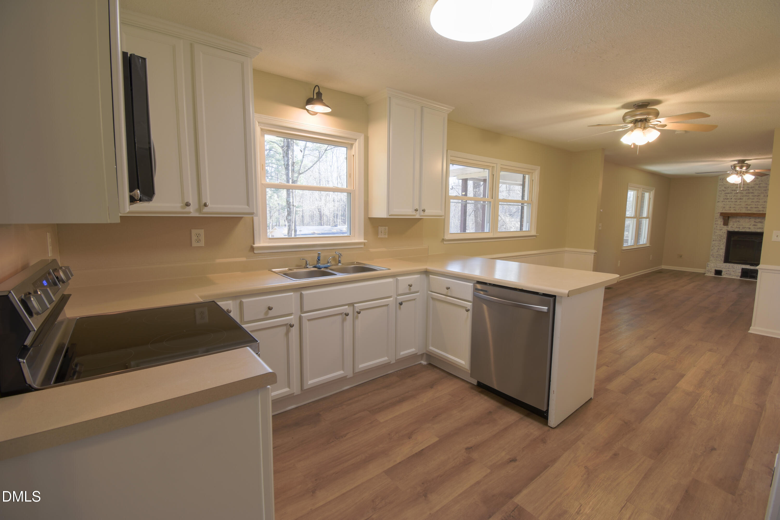 1412 Chamblee Road Zebulon, NC 27597 - Photo 2 of 22 a kitchen that has a sink and a stove in it