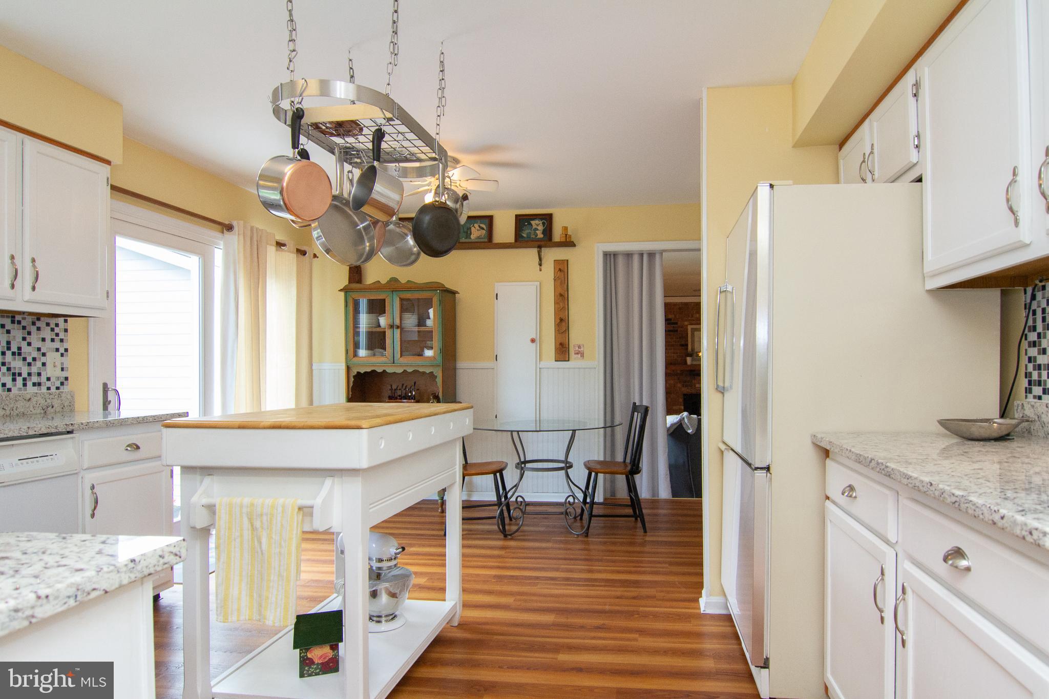 4208 Arthur Shipley Road Westminster, MD 21157 - Photo 9 of 35 White kitchen with updated counters, backsplash...