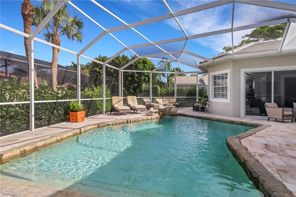 2127 Harlans Run Naples, FL 34105 - Photo 21 of 22 a view of a swimming pool with a patio