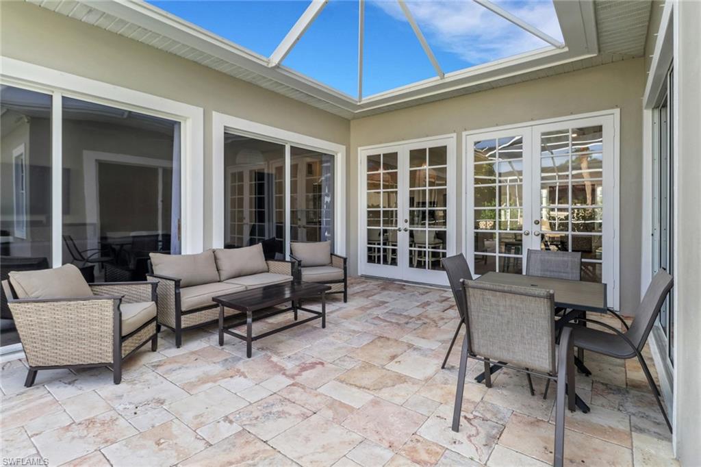 2127 Harlans Run Naples, FL 34105 - Photo 22 of 22 a outdoor living space with furniture and garden view
