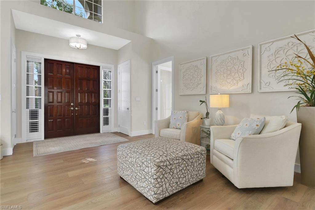 2127 Harlans Run Naples, FL 34105 - Photo 3 of 22 a living room with furniture and a window