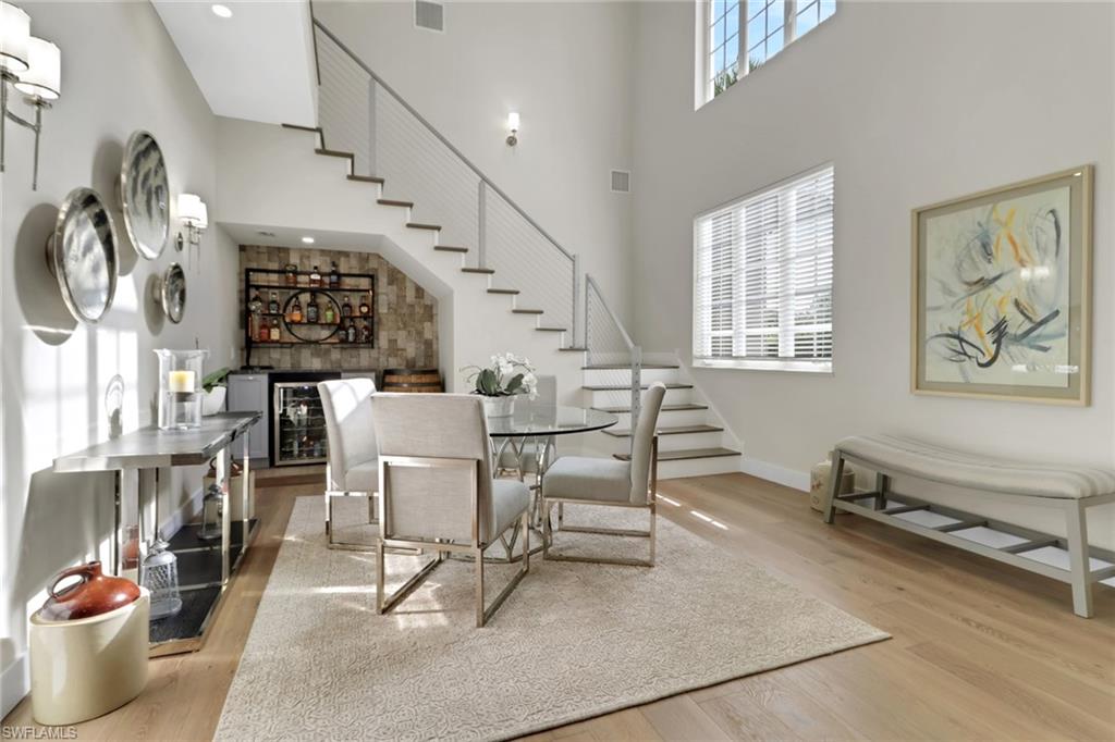 2127 Harlans Run Naples, FL 34105 - Photo 4 of 22 a dining room with furniture and wooden floor