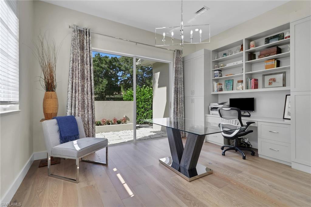 2127 Harlans Run Naples, FL 34105 - Photo 5 of 22 a view of a livingroom with workspace and a window