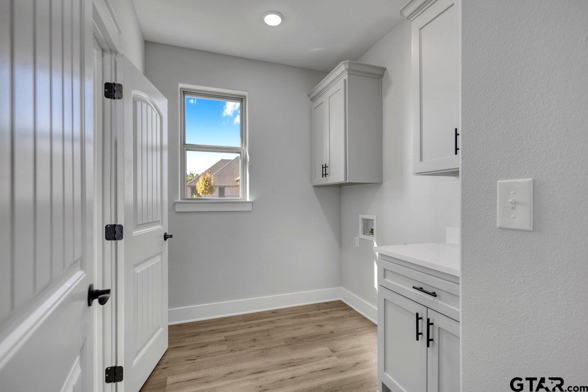 15531 Sugar Rdg Lane Flint, TX 75762 - Photo 22 of 45 a view of an empty room with wooden floor and a window