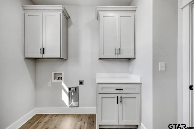 a view of cabinets and wooden floor