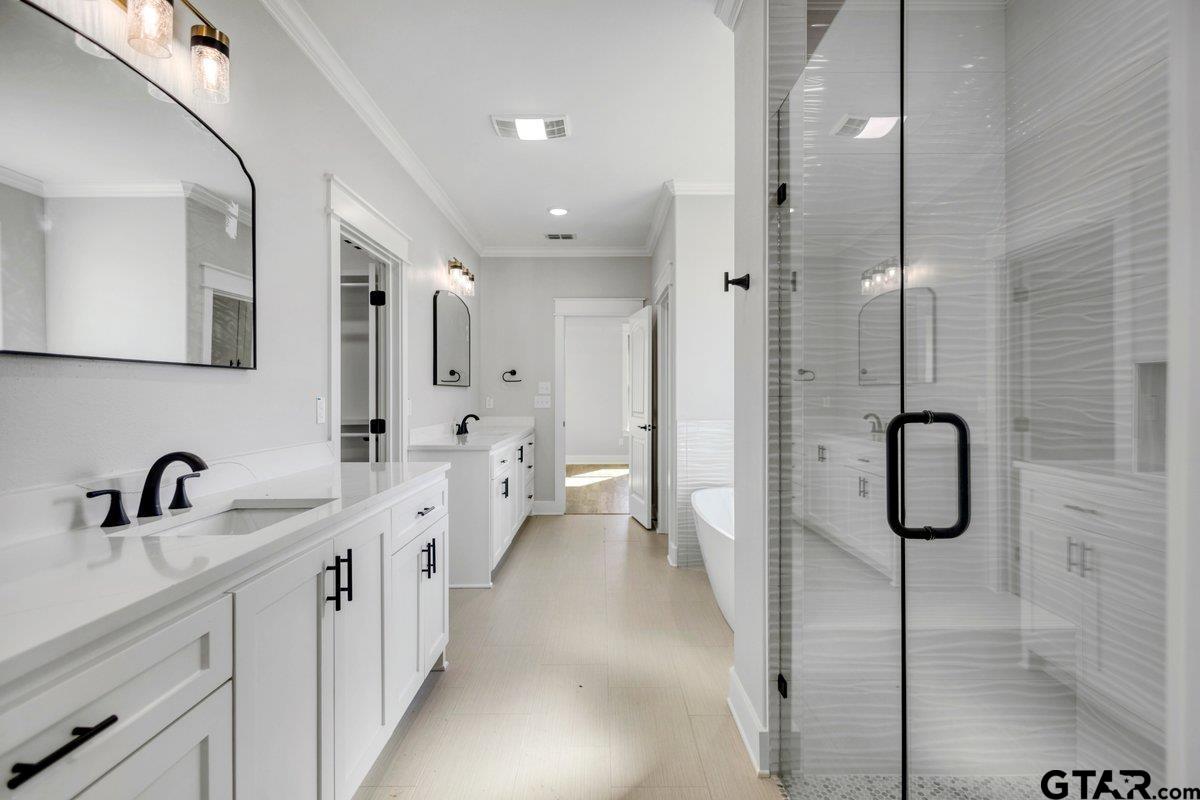 15531 Sugar Rdg Lane Flint, TX 75762 - Photo 24 of 45 a spacious bathroom with a shower sink and mirror