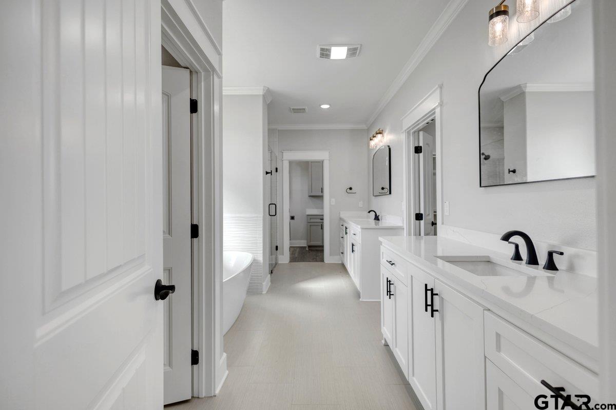 15531 Sugar Rdg Lane Flint, TX 75762 - Photo 26 of 45 a bathroom with a double vanity sink mirror and shower