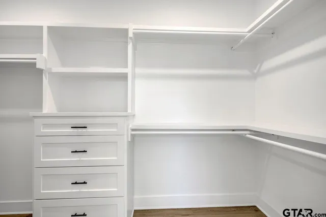 a view of an empty walk in closet