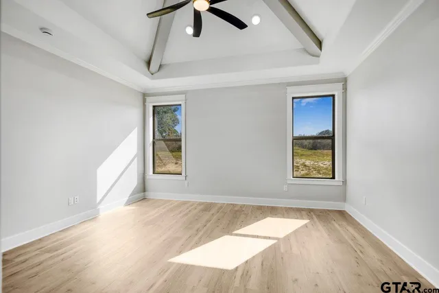 a view of an empty room and a window