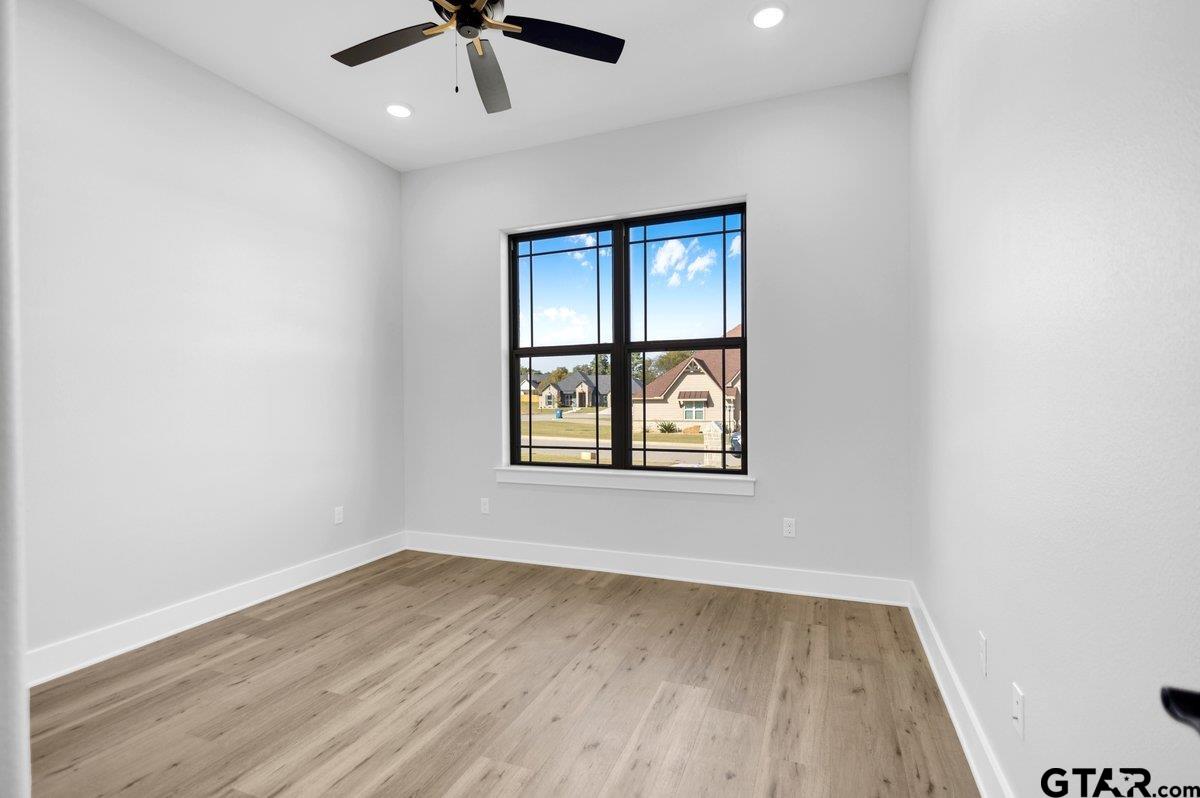 15531 Sugar Rdg Lane Flint, TX 75762 - Photo 43 of 45 an empty room with a window and wooden floor