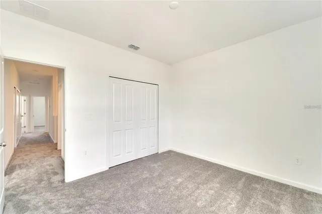 an empty room with a hallway