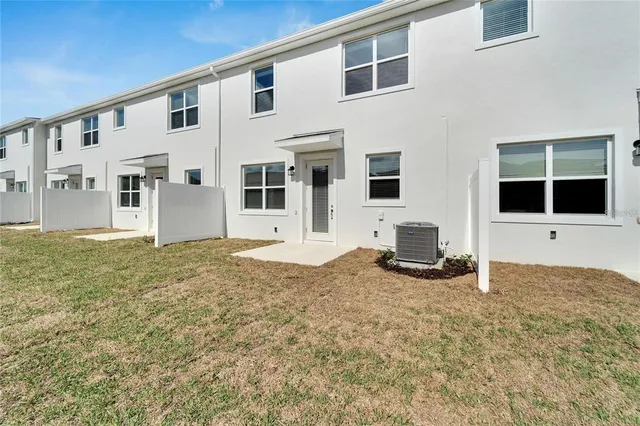 a view of a house with backyard of the house