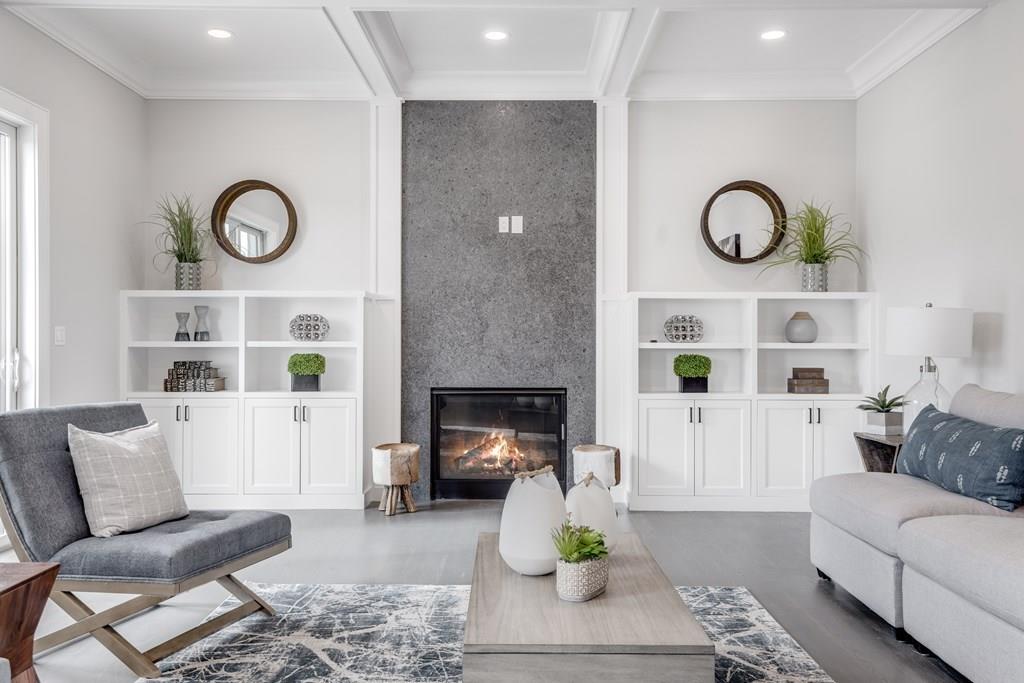 819 Dedham Street Newton, MA 02459 - Photo 11 of 40 a living room with furniture and a fireplace