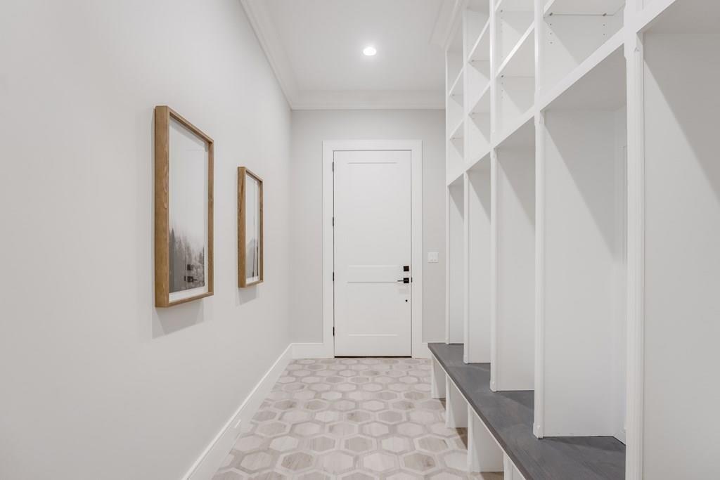 819 Dedham Street Newton, MA 02459 - Photo 19 of 40 a view of a hallway with staircase