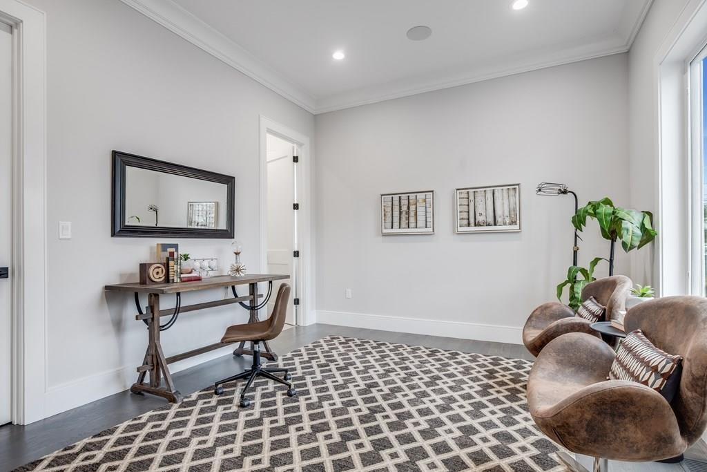 819 Dedham Street Newton, MA 02459 - Photo 20 of 40 a living room with furniture and a rug