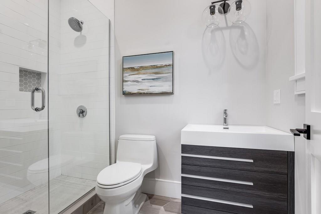 819 Dedham Street Newton, MA 02459 - Photo 21 of 40 a bathroom with a toilet sink and shower