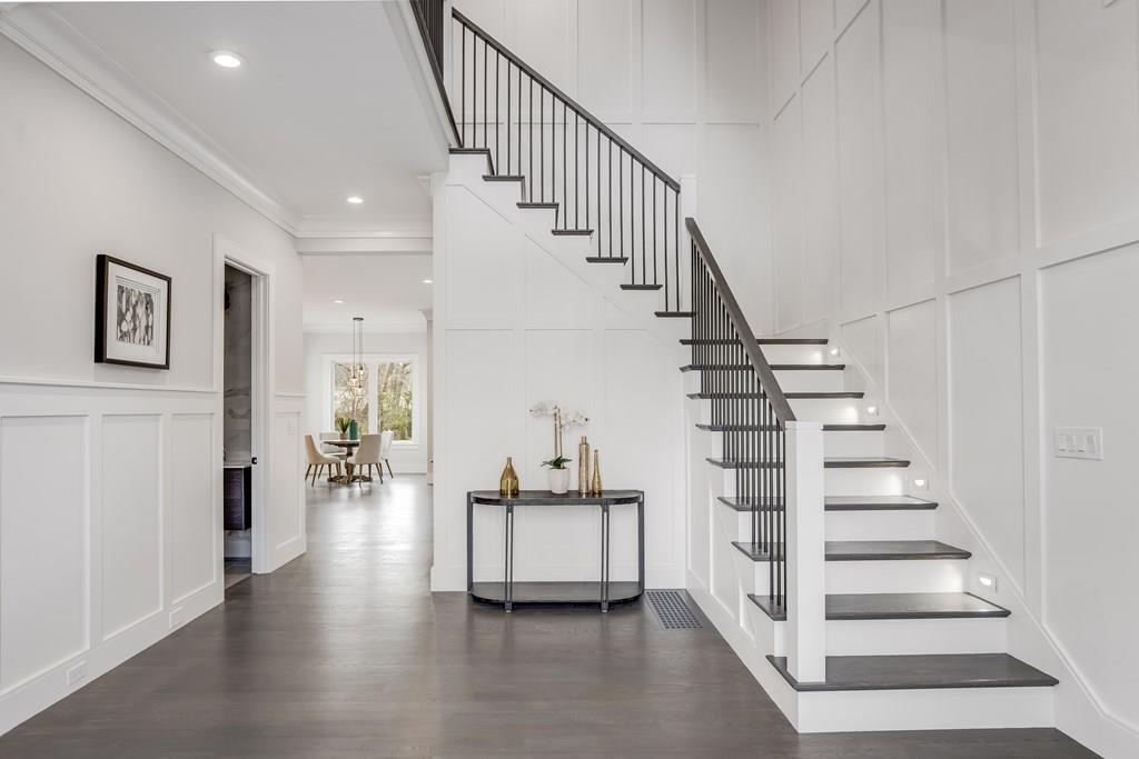 819 Dedham Street Newton, MA 02459 - Photo 3 of 40 a view of entryway and hall with wooden floor