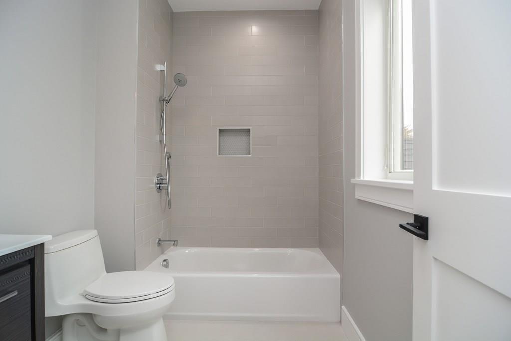 819 Dedham Street Newton, MA 02459 - Photo 31 of 40 a white toilet sitting next to a white tub