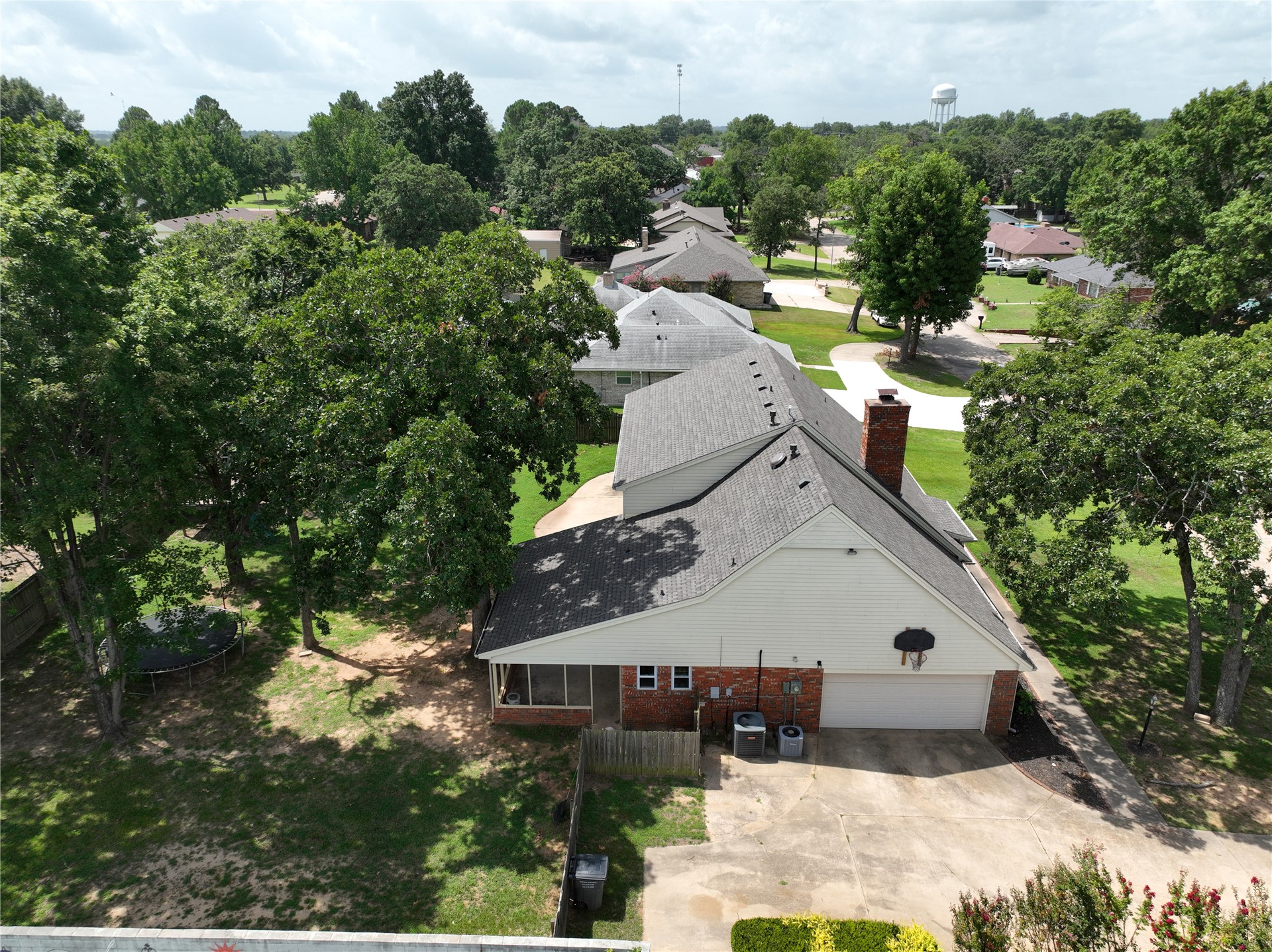 18 Dove Tree Road Wewoka, OK 74884 - Photo 60 of 65 Expansive backyard featuring mature trees and a screened-in porch