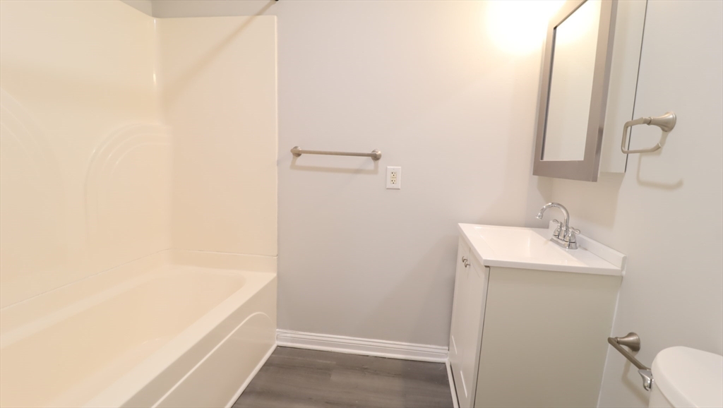 178 High Street, Unit 304 Clinton, MA 01510 - Photo 13 of 24 a bathroom with a sink and a mirror
