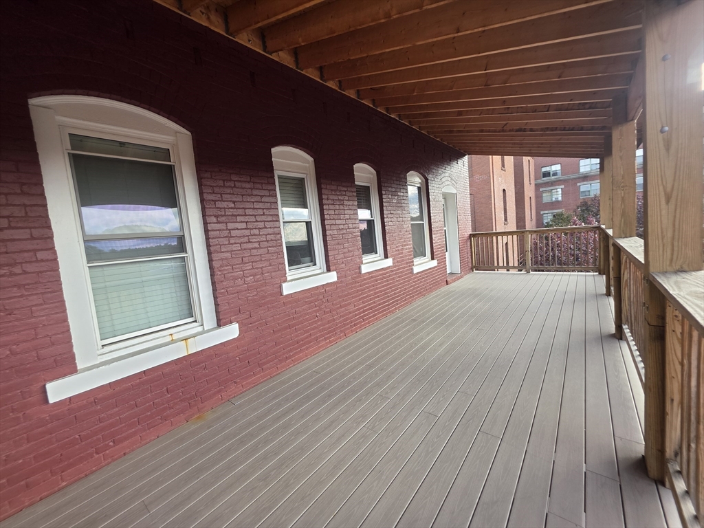 178 High Street, Unit 304 Clinton, MA 01510 - Photo 21 of 26 a view of a house with a barbeque