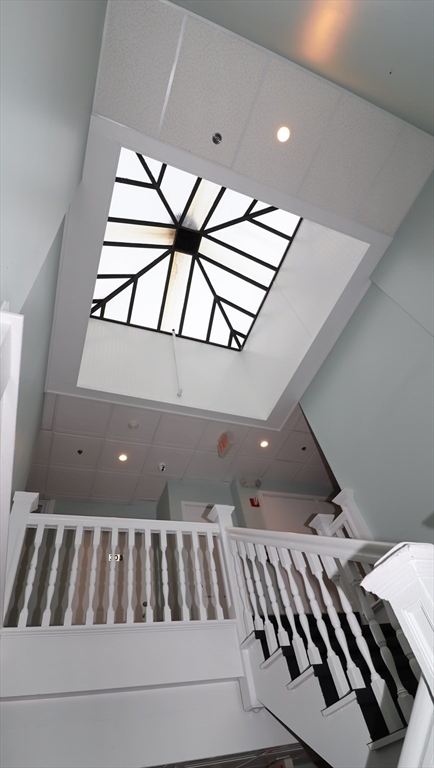 178 High Street, Unit 304 Clinton, MA 01510 - Photo 24 of 26 a view of staircase with lots of frames on wall